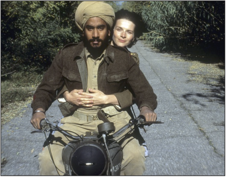 Nurse Hana (Juliette Binoche) rides with her lover, Kip Singh (Naveen William Sidney Andrews) in the movie The English Patient.