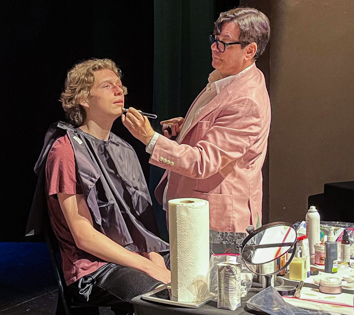 Donald Mowat, right, shares his makeup artistry with an unknown student during a visit to the Brookhaven campus recently.