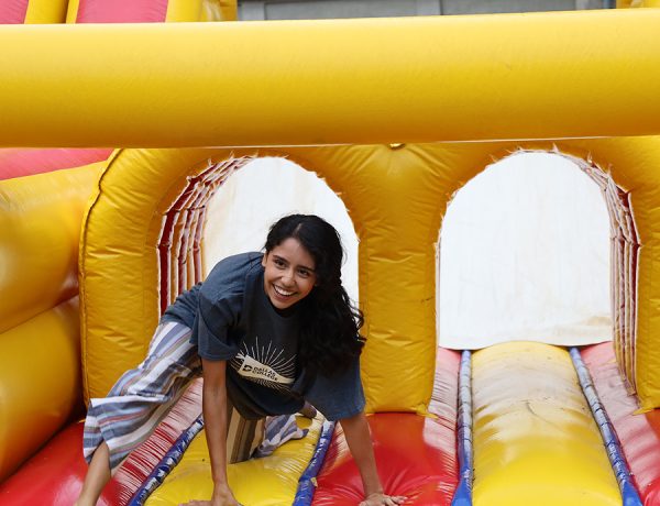 Sofia Barba bounces through the obstacle course hosted by OSL at Ducktoberfest.