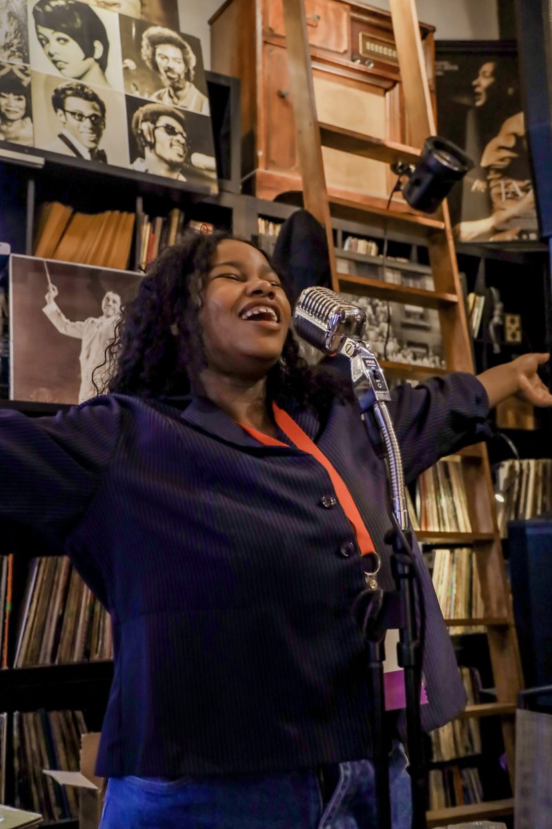 Chronicle staff writer Tracey Nicholas sings at the W.E.R.D. museum.