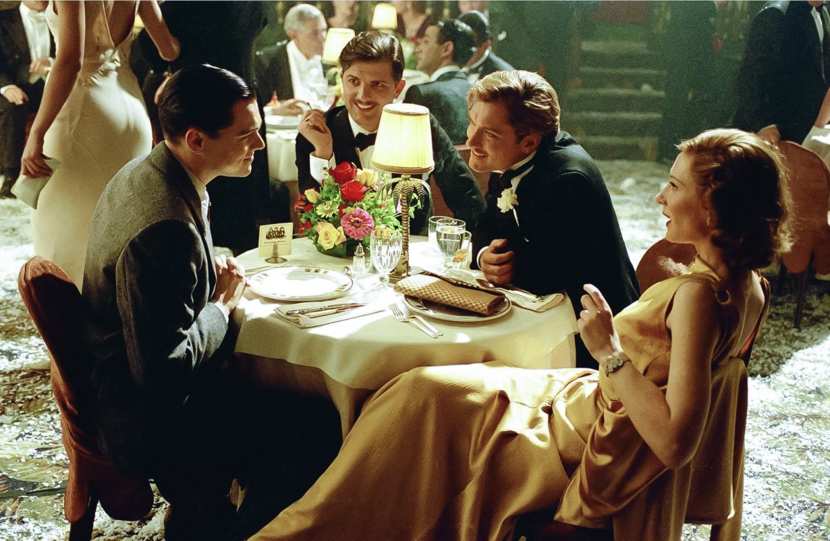 Leonardo DiCaprio as Howard Hughes, left, Adam Scott as Johnny Meyer, Jude Law as Errol Flynn and Cate Blanchett as Katharine Hepburn star in Martin Scorsese's "The Aviator."