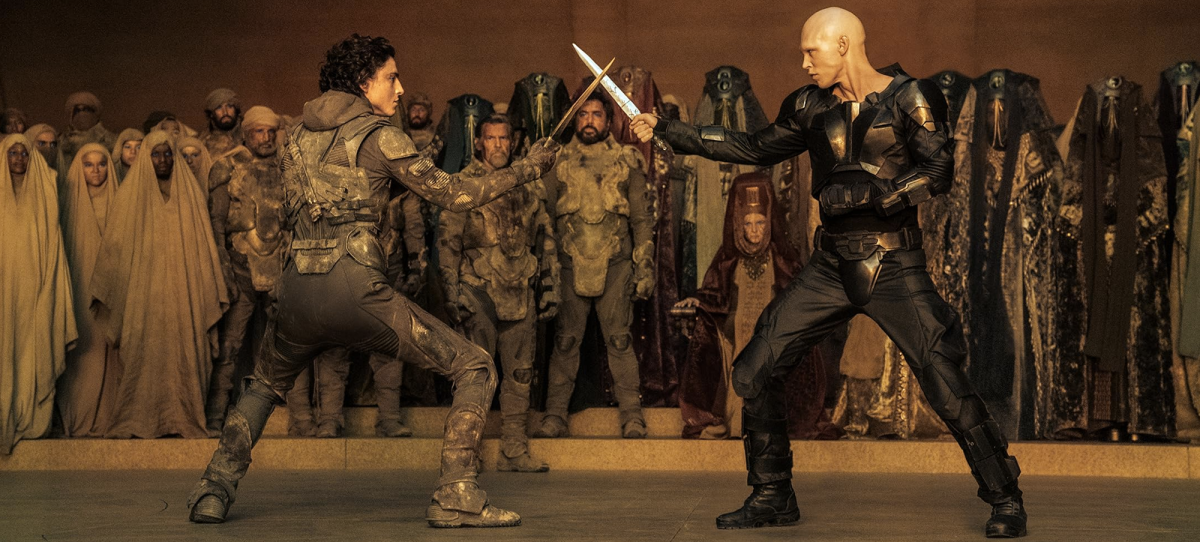 Paul Atreides (played by Timothée Chalamet), left, and Feyd-Rautha (played by Austin Butler) fight it out in "Dune: Part Two."