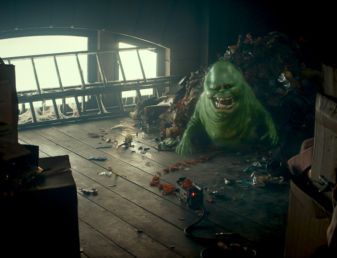 Slimer is lured into a ghost trap after being accidentally released in Ghostbusters: Frozen Empire.