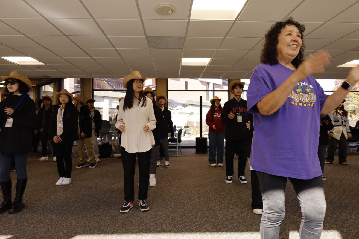 Taiwanese Students line dance in El Paso Hall with Kay Coder.