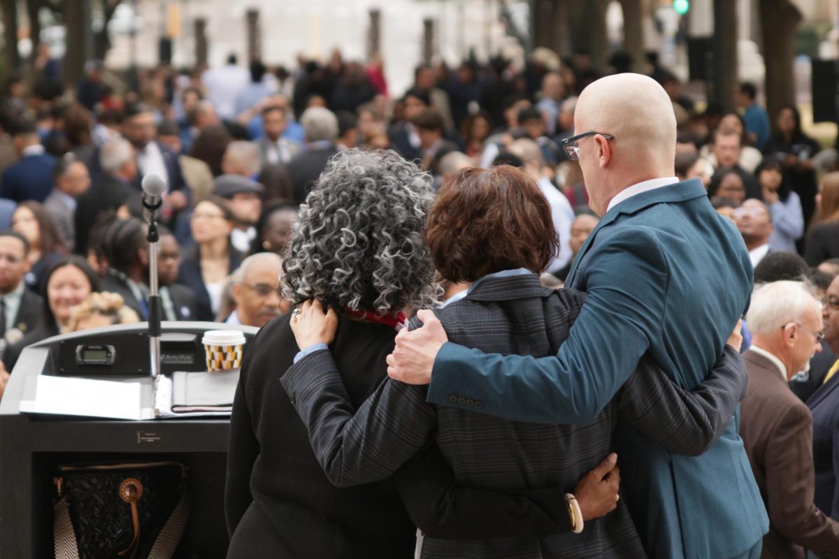 Susan Moore-Fontenot (left) faces Community College Day crowd with colleagues.