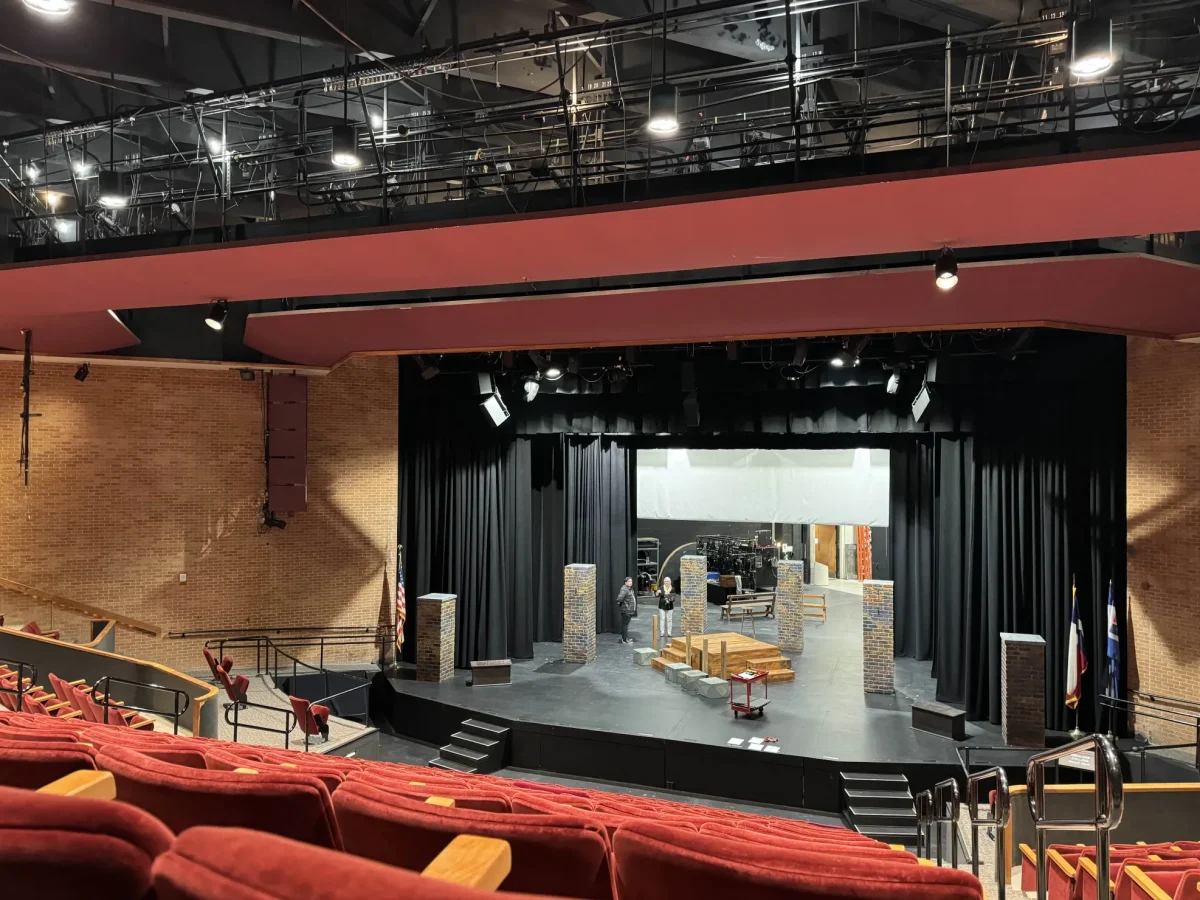 Richland Theater Group members set up stage for upcoming “Emilia” performances.