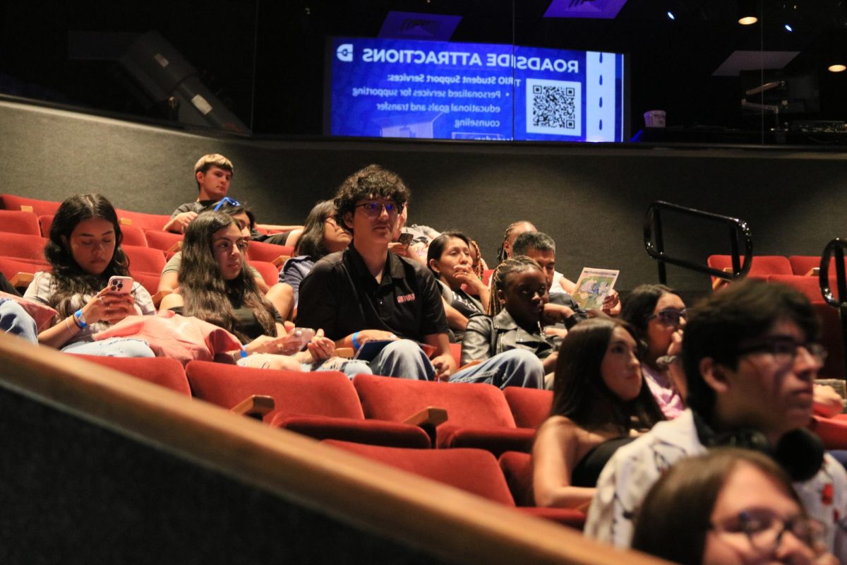Upcoming freshmen listen attentively to orientation speakers before breaking off in groups for campus tours.