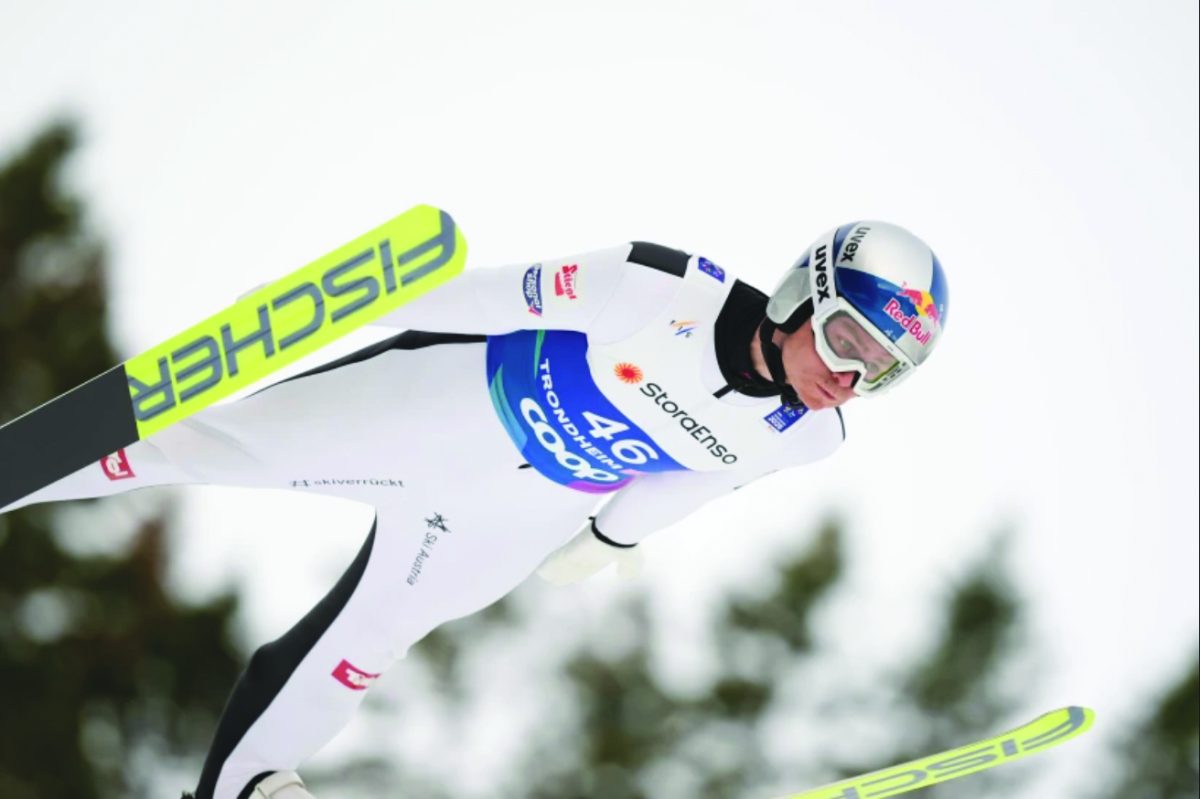Johannes Lamparter, of Austria, soars through the air in a trial lap of the Nordic combined.