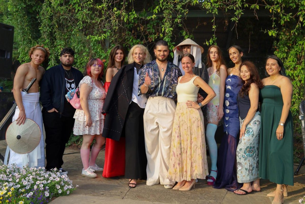 Members of the Dallas College fashion showcase program pose for a group photo after completing the final round of their show at the Bits &Bites Food Festival.