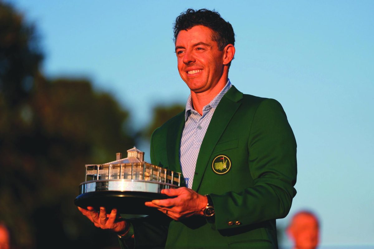 Rory McIlroy showcases his green jacket after winning the Masters title consecutively.