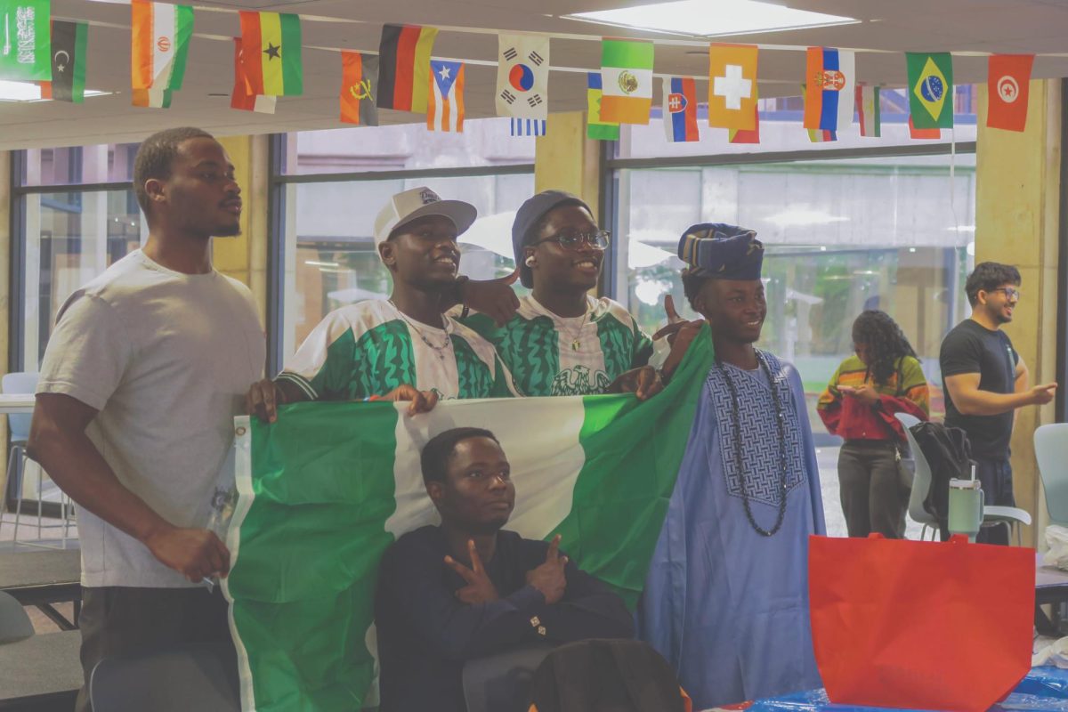 International Club members join together to watch the soccer game during Cultural Day in the El Paso Student Lounge.